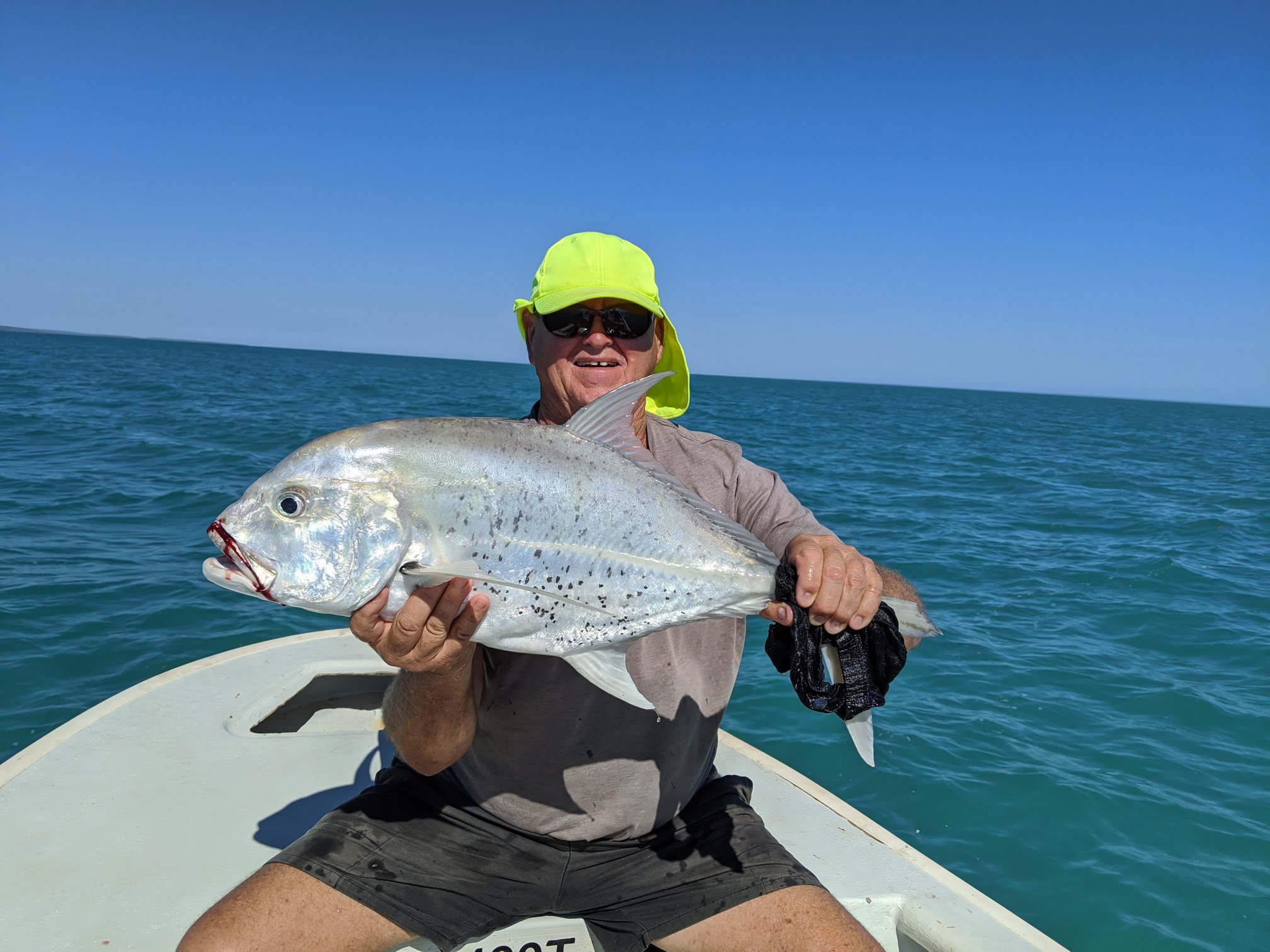 sport fisherman with his catch Northern Territory Australian Sportfishing charters