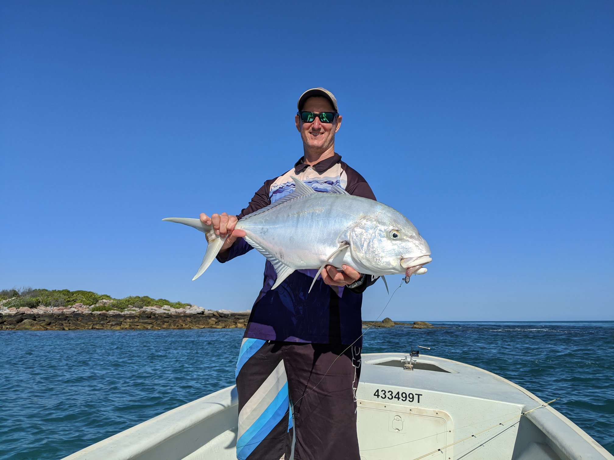 sportsman with his fish catch Northern Territory