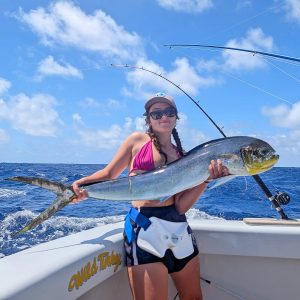 Ribbons Ladies Game Fishing Tournament runner-up Skyla McShane, with a dolphin fish onboard Wild Turkey